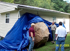 A huge boulder smashed into a Kentucky home