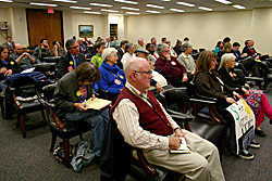 NC residents wait to speak at a hearing on Duke Energy's proposed rate hike
